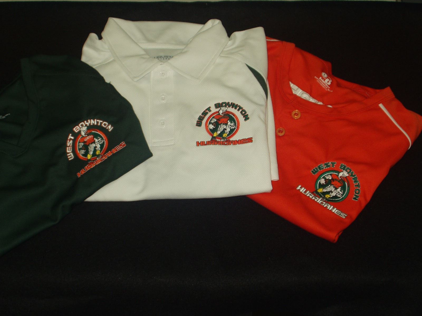 Different color polo shirts with custom team embroidery